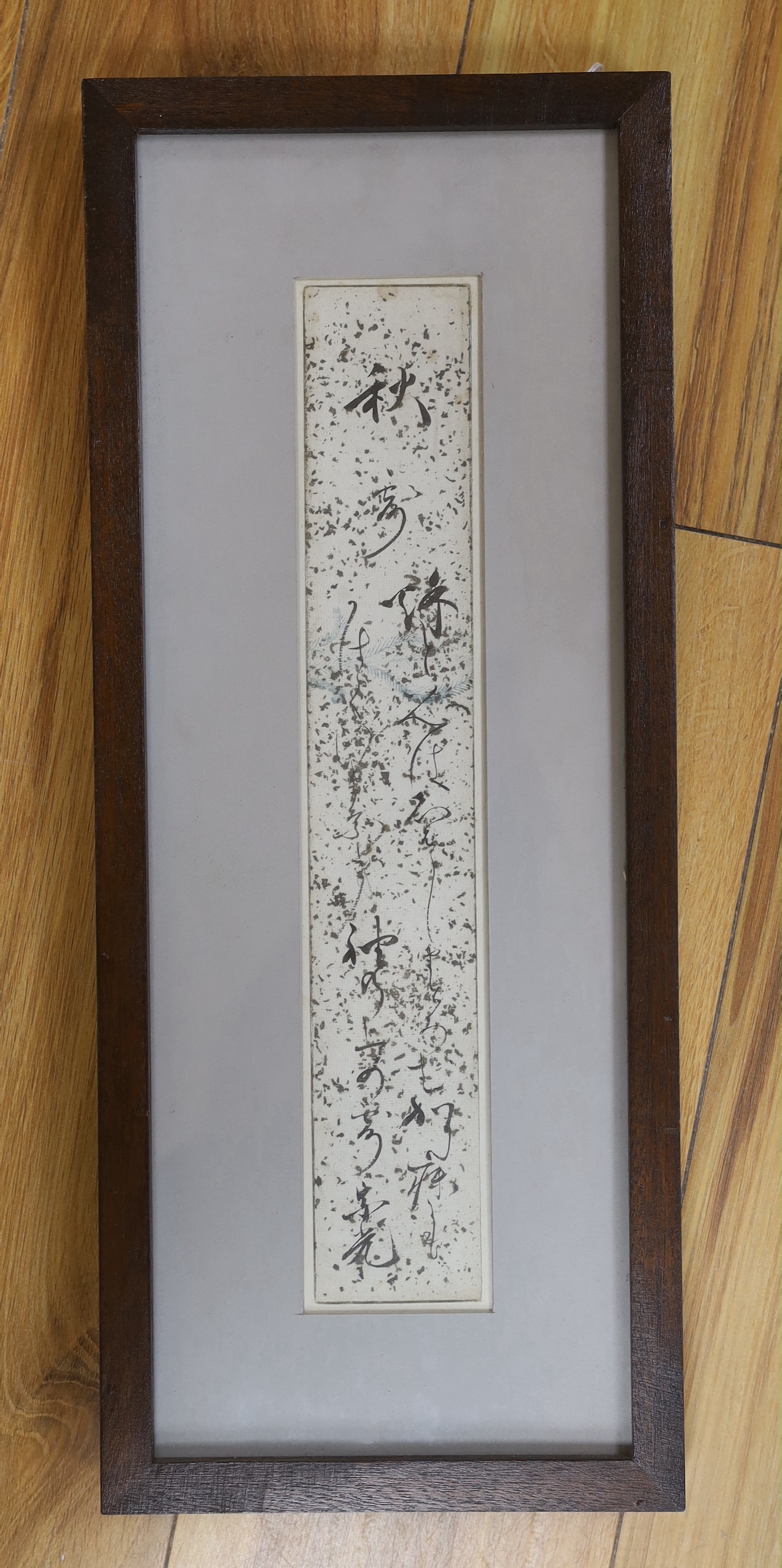A Japanese framed poem, 35 x 6cm